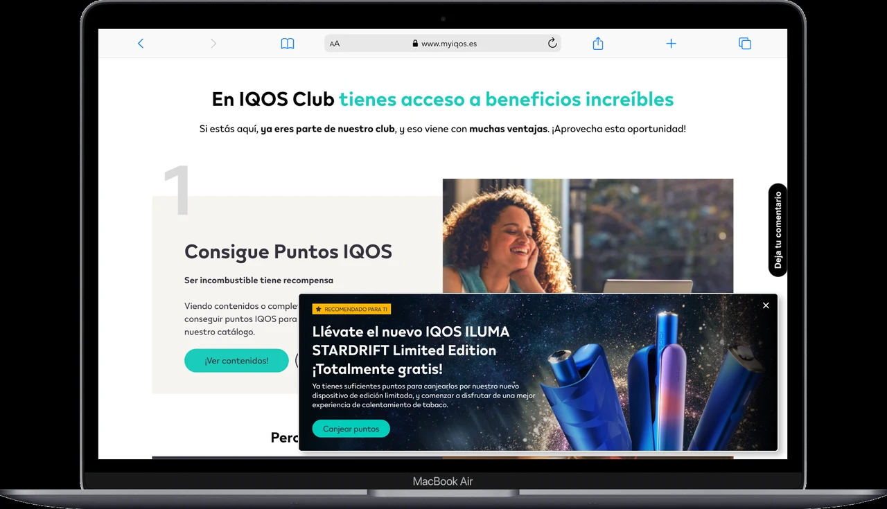 MacBook Air showing IQOS ILUMA Stardrift promotional modal on the IQOS Club portal